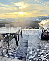 Sonnenuntergang auf der gemütlichen Dachterrasse